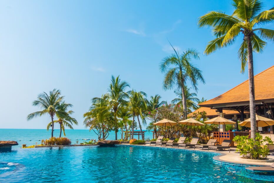 Bright sunny day on Bai Dai Beach with clear turquoise water, illustrating the best time to visit Cam Ranh for beach relaxation.