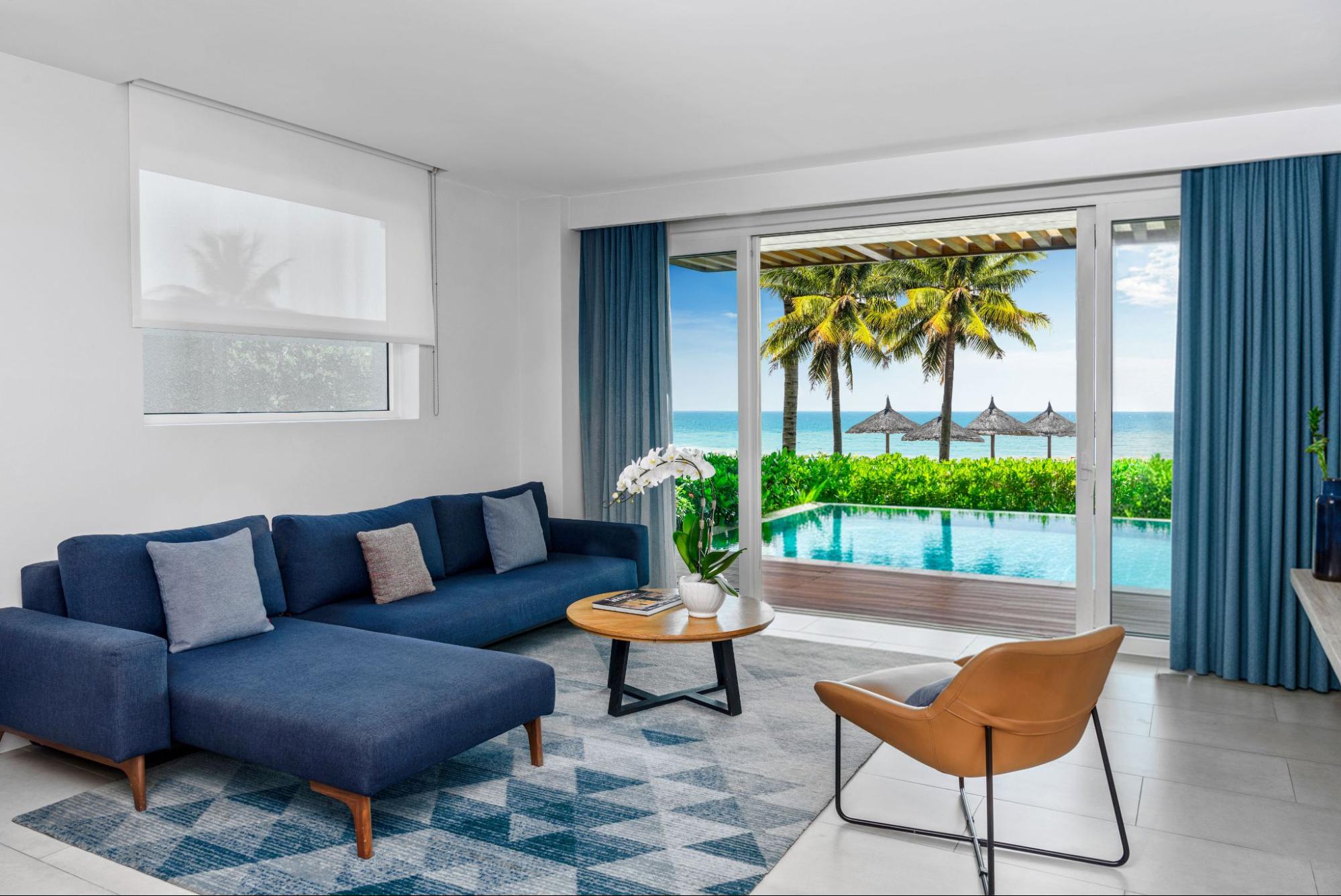 Spacious family suite with ocean views and comfortable living space, representing accommodation at family resorts in Cam Ranh.