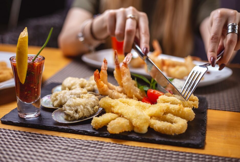 Travelers exploring local seafood markets and coastal villages, reflecting authentic things to do in Cam Ranh.