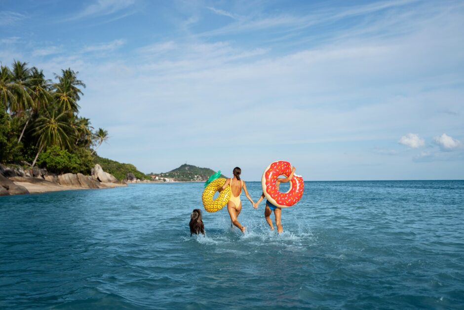 Calm crystal-clear sea with gentle waves and blue skies, highlighting the peaceful atmosphere of Cam Ranh beaches.