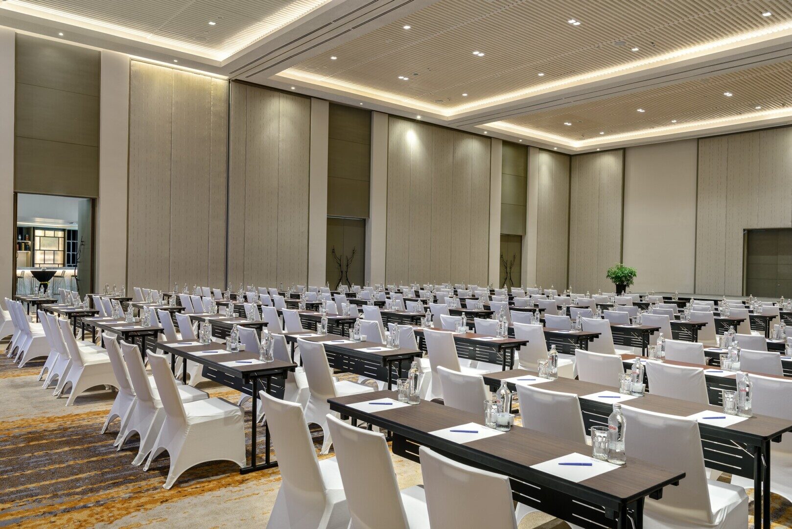 Executive meeting room with natural light and advanced AV equipment, representing high-end corporate venues in Cam Ranh.