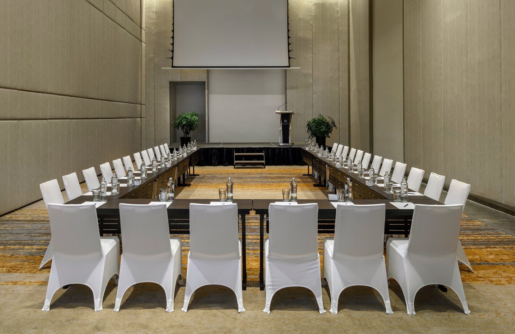 Executive meeting room with natural light and advanced AV equipment, representing high-end corporate venues in Cam Ranh.